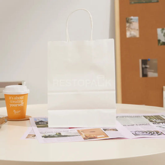 8 1/4" × 4 5/16" × 10 5/8" Tall White Kraft Paper Bag with Handles